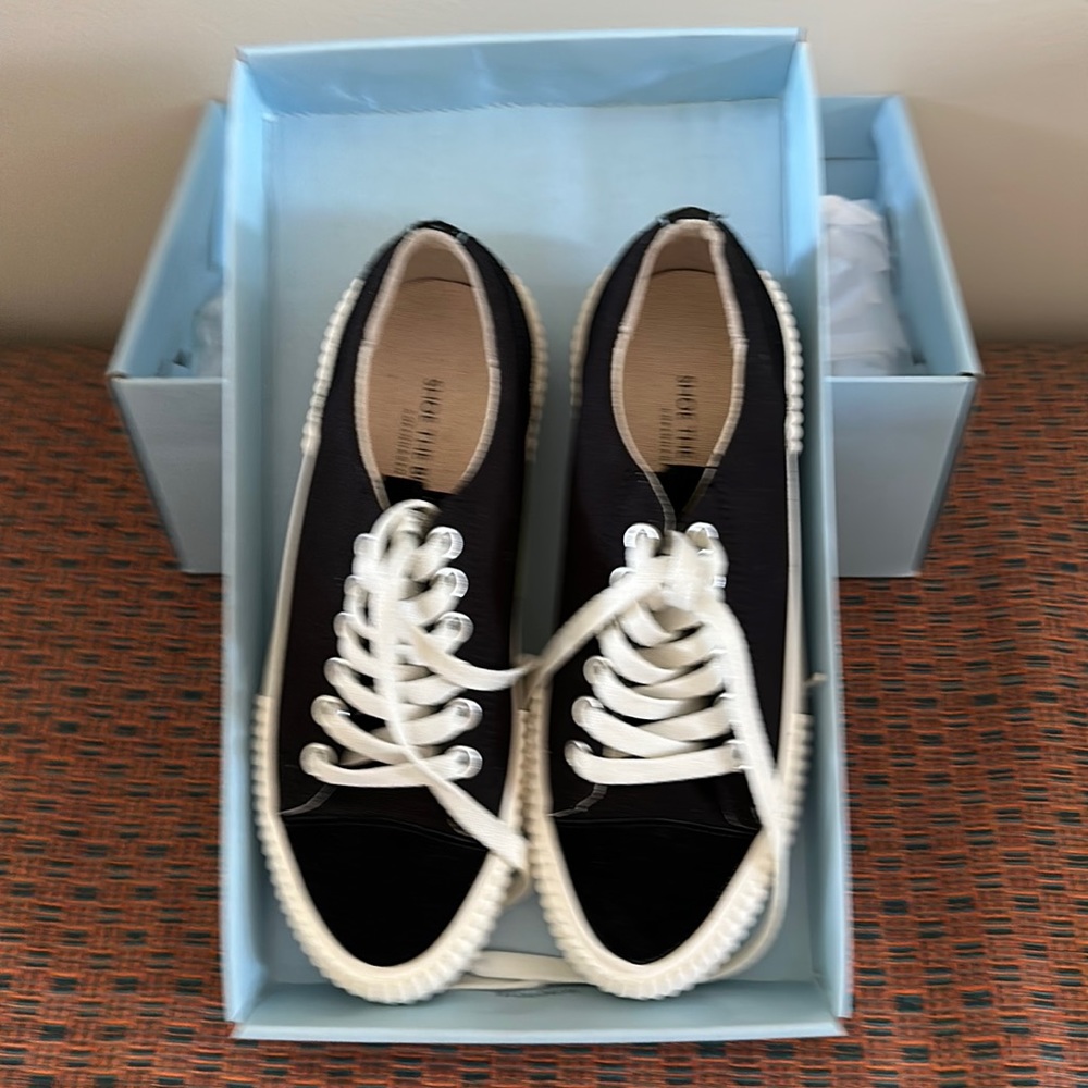 Black canvas tennis shoes. Size 38 (runs big, like an 8 1/2). Perfect condition